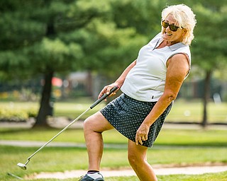 DIANNA OATRIDGE | THE VINDICATOR Gayle George reacts as she watches her putt during the Ladies 2-player Championship of the Greatest Golfer of the Valley held at Trumbull Country Club in Warren on Wednesday.