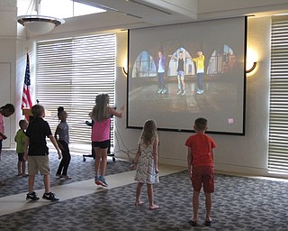 Neighbors | Jessica Harker.Children jumped along to a Kids Bop dance video played at the Gotta Move 2.0 event at the Austintown library.