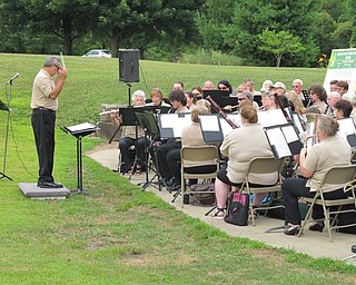Neighbors | Jessica Harker.Director Joe Pellergrini led the Youngstown Area Community Concert Band on June 24 at the Austintown Park.