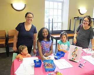 Neighbors | Natalie Wright.From left, Helene Martinez, Blake Bowes, Makenzie, Bailey Bowes and Bridget Bowes colored musical notes together at one of the craft stations during the Shimmy, Shake and Make even on July 23.
