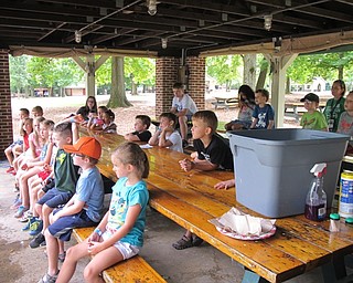Neighbors | Jessica Harker.Campers in the kindergarten through first-grade age group listened to the ODNR division of wildlife's presentation on Ohio fish in Boardman Park on Aug. 7.