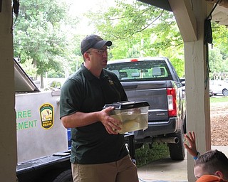 Neighbors | Jessica Harker.A volunteer from the Ohio Division of Natural Resources divison of wildlife came and spoke to a group of campers about Ohio fish on Aug. 7 in Boardman Park.