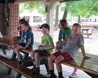 Neighbors | Jessica Harker.Campers in the kindergarten through first-grade age group, along with camp director Karen McCallum listened to the ODNR division of wildlife's presentation in Boardman Park.