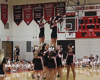Neighbors | Abby Slanker.The Canfield High School varsity cheerleaders performed a cheer for campers and parents at their annual Kiddie Cheer Camp on Aug. 8.