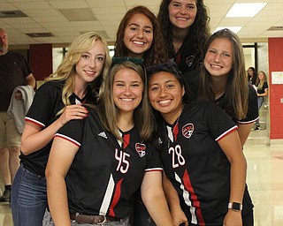 Neighbors | Abby Slanker.Senior members of the Canfield Cardinals girls varsity soccer team, from left,  (front) Alexis Bernat, Lauren Slanker, Fiona Lally; (back) Julia Petrallo, Ashley Story and Brianna Remias, celebrated the start of their senior season at the Soccer Boosters’ annual Meet the Team event.