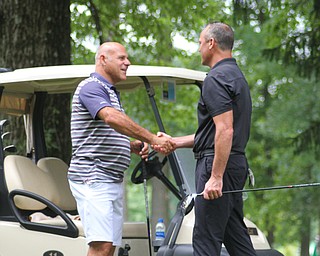 William D. Lewis The Vindicator Ron Snyder, left, shakes hand with Hank Morris during during GGOV at Mill creek 8-17-18.