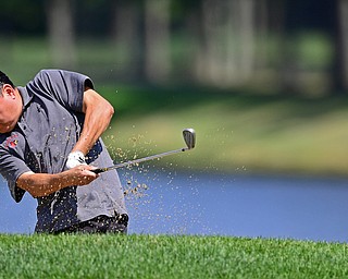 HOWLAND, OHIO - AUGUST 18, 2018: Andrew Smyczynski of Canfield watches his shot from the bunker on the ninth hole, Saturday afternoon during the Vindy Greatest Golfer at Avalon Lakes. DAVID DERMER | THE VINDICATOR