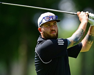 HOWLAND, OHIO - AUGUST 18, 2018: Cory Stevens of Girard watches his tee shot on the seventh hole, Saturday afternoon during the Vindy Greatest Golfer at Avalon Lakes. DAVID DERMER | THE VINDICATOR