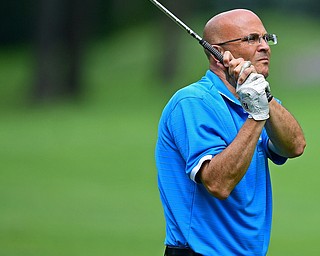 HOWLAND, OHIO - AUGUST 18, 2018: Tony Amendola of Boardman watches his approach shot on the fifth hole, Saturday afternoon during the Vindy Greatest Golfer at Avalon Lakes. DAVID DERMER | THE VINDICATOR