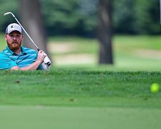 HOWLAND, OHIO - AUGUST 18, 2018: Corey Keller of Boardman watches his shot from the bunker on the fifth hole, Saturday afternoon during the Vindy Greatest Golfer at Avalon Lakes. DAVID DERMER | THE VINDICATOR