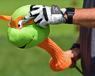 HOWLAND, OHIO - AUGUST 18, 2018: Bill Shoveling removes his Teenage Mutant Ninja Turtles head cover from his driver before teeing off on the first hole, Saturday afternoon during the Vindy Greatest Golfer at Avalon Lakes. DAVID DERMER | THE VINDICATOR