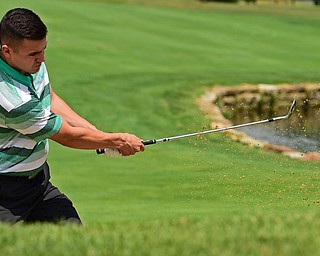 HOWLAND, OHIO - AUGUST 18, 2018: Dan Diloreto of Struthers watches his shot from the bunker on the ninth hole, Saturday afternoon during the Vindy Greatest Golfer at Avalon Lakes. DAVID DERMER | THE VINDICATOR