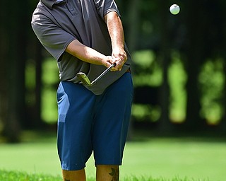 HOWLAND, OHIO - AUGUST 18, 2018: Paul J. Harris of Canfield watches his chip shot from the short rough on the sixth hole, Saturday afternoon during the Vindy Greatest Golfer at Avalon Lakes. DAVID DERMER | THE VINDICATOR