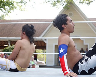 Cree Fudo, left, and Marc-Anthony Alejandro wrestle at the Latino Heritage Festival in Campbell on Saturday. EMILY MATTHEWS | THE VINDICATOR