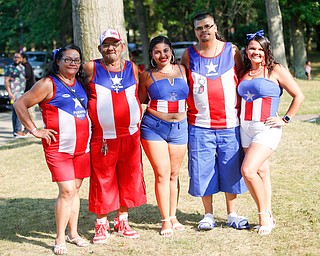 From left, Juana Silva, Francisco Laviena, Aleishka Rodriguez, Carmelo Cintron, and Alexandra Laviena, all of Youngstown and originally from Puerto Rico, pose for a photo at the Latino Heritage Festival in Campbell on Saturday. EMILY MATTHEWS | THE VINDICATOR