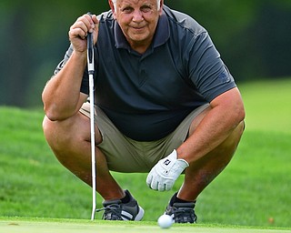 POLAND, OHIO - AUGUST 19, 2018: Glenn Milton, of Struthers, reads the green on the eighth hole during the final round of the Vindy Greatest Golfer, Sunday afternoon at the Lake Club. DAVID DERMER | THE VINDICATOR