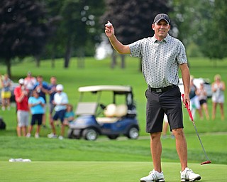 POLAND, OHIO - AUGUST 19, 2018: Scott Porter, of Canfield, waves after his putt on the 18th hole during the final round of the Vindy Greatest Golfer, Sunday afternoon at the Lake Club. DAVID DERMER | THE VINDICATOR