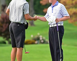 POLAND, OHIO - AUGUST 19, 2018: Scott Porter, of Canfield, left, shakes hands with Joey Cilone after the completion of their round, Sunday afternoon at the Lake Club. DAVID DERMER | THE VINDICATOR