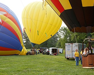 People get ready to take off while other balloons are inflated at the Hot air balloon festival at Mastropietro Winery on Sunday..