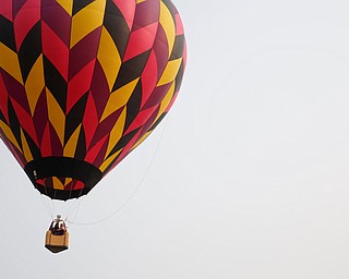 A hot air balloon floats in the air at the Hot air balloon festival at Mastropietro Winery on Sunday.