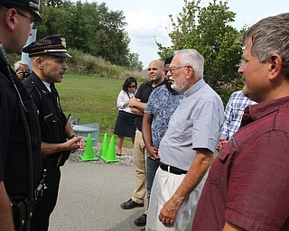  ROBERT K.YOSAY  | THE VINDICATOR..In the spirit of the afternoon, Akron-Canton area residents John Beaty, Austin Miller, Dustin White, James Talbert and JR Rozco prepared for their arrest with a song...After three hours of protest chants, the five clergy members stood at the entrance of the Northeast Ohio Correctional Center on Youngstown-Hubbard Road on Monday with their arms around each other and sang ÒNearer, My God, To TheeÓ Ð the hymn associated with the sinking of the Titanic....-30-