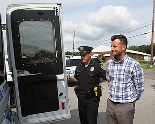  ROBERT K.YOSAY  | THE VINDICATOR..In the spirit of the afternoon, Akron-Canton area residents John Beaty, Austin Miller, Dustin White, James Talbert and JR Rozco prepared for their arrest with a song...After three hours of protest chants, the five clergy members stood at the entrance of the Northeast Ohio Correctional Center on Youngstown-Hubbard Road on Monday with their arms around each other and sang ÒNearer, My God, To TheeÓ Ð the hymn associated with the sinking of the Titanic....-30-