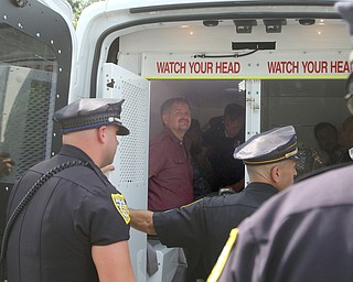  ROBERT K.YOSAY  | THE VINDICATOR..In the spirit of the afternoon, Akron-Canton area residents John Beaty, Austin Miller, Dustin White, James Talbert and JR Rozco prepared for their arrest with a song...After three hours of protest chants, the five clergy members stood at the entrance of the Northeast Ohio Correctional Center on Youngstown-Hubbard Road on Monday with their arms around each other and sang ÒNearer, My God, To TheeÓ Ð the hymn associated with the sinking of the Titanic....-30-