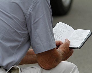  ROBERT K.YOSAY  | THE VINDICATOR..In the spirit of the afternoon, Akron-Canton area residents John Beaty, Austin Miller, Dustin White, James Talbert and JR Rozco prepared for their arrest with a song...After three hours of protest chants, the five clergy members stood at the entrance of the Northeast Ohio Correctional Center on Youngstown-Hubbard Road on Monday with their arms around each other and sang ÒNearer, My God, To TheeÓ Ð the hymn associated with the sinking of the Titanic....-30-