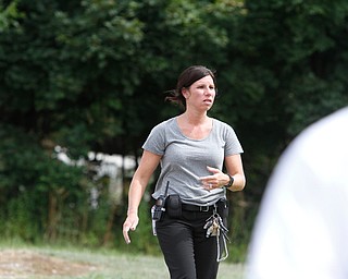  ROBERT K.YOSAY  | THE VINDICATOR..In the spirit of the afternoon, Akron-Canton area residents John Beaty, Austin Miller, Dustin White, James Talbert and JR Rozco prepared for their arrest with a song...After three hours of protest chants, the five clergy members stood at the entrance of the Northeast Ohio Correctional Center on Youngstown-Hubbard Road on Monday with their arms around each other and sang ÒNearer, My God, To TheeÓ Ð the hymn associated with the sinking of the Titanic....-30-