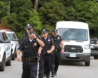  ROBERT K.YOSAY  | THE VINDICATOR..In the spirit of the afternoon, Akron-Canton area residents John Beaty, Austin Miller, Dustin White, James Talbert and JR Rozco prepared for their arrest with a song...After three hours of protest chants, the five clergy members stood at the entrance of the Northeast Ohio Correctional Center on Youngstown-Hubbard Road on Monday with their arms around each other and sang ÒNearer, My God, To TheeÓ Ð the hymn associated with the sinking of the Titanic....-30-