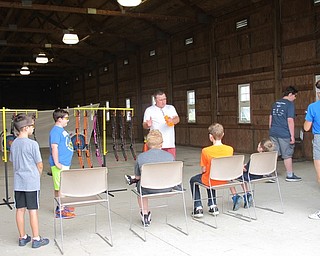 Neighbors | Jessica Harker .Instructor Steve Adams explained various techniques to students before they began practicing on July 24 at the annual archery camp.