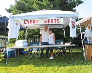 Neighbors | Jessica Harker.Larry and Jan Green ran the T-shirt stand during the 40th annual MVOCC car show in Boardman Park.
