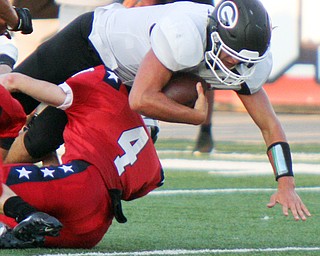 William D. Leiws The Vindicator  Girard's Mark Waid (7) is stopped by Niles's Trent Johnson (4) during the Aug. 23 game at Niles.