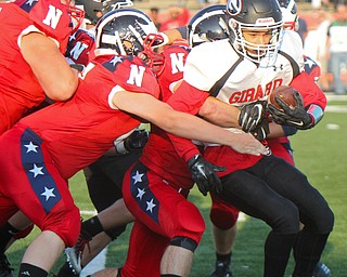 William D. Leiws The Vindicator  Girard's Morgan Clardy(2) is stopped a host of Niles defenders during 8-23-18 action at Niles.
