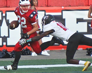 William D. Leiws The Vindicator  Niles's Travis Molnar (22) is stopped by Giard's Jamil Bannister (10) during the game at Niles on Aug. 23, 2018.