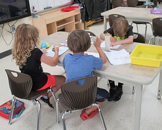 Neighbors | Jessica Harker.Children worked at a center during the Austintown Elementary School's Success by 6 program.