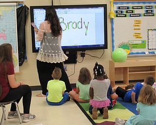 Neighbors | Jessica Harker.Success by 6 teacher Kelley Mills used the smart board during class time at Austintown Elementary School.