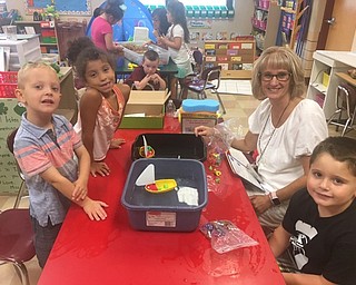 Neighbors | Submitted.Nicholas Herold, Ce'yonna Guzzo, Tracy Marsco and Cole Fleet worked in a small group on developing interest in STEM during Boardman's Success by 6 program.