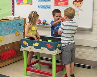 Neighbors | Jessica Harker.Children worked in a small group during the Success by 6 program at Poland Union Elementary School.