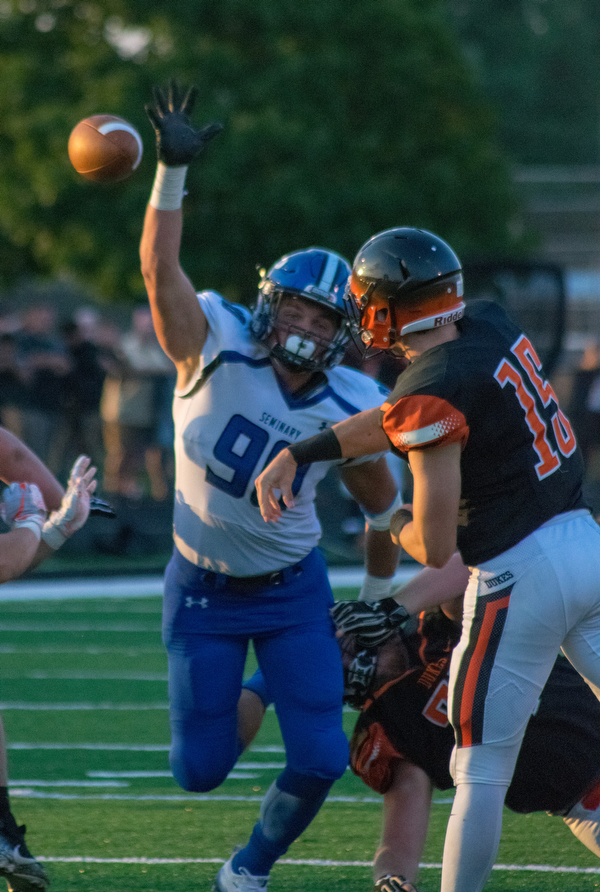Poland defensive lineman Scott Campbell tries to knock down a pass from Marlington quarterback C.J. Greiner in the Bulldogs’ 17-14 win Thursday night in Alliance..￼.BOB ETTINGER | THE VINDICATOR
