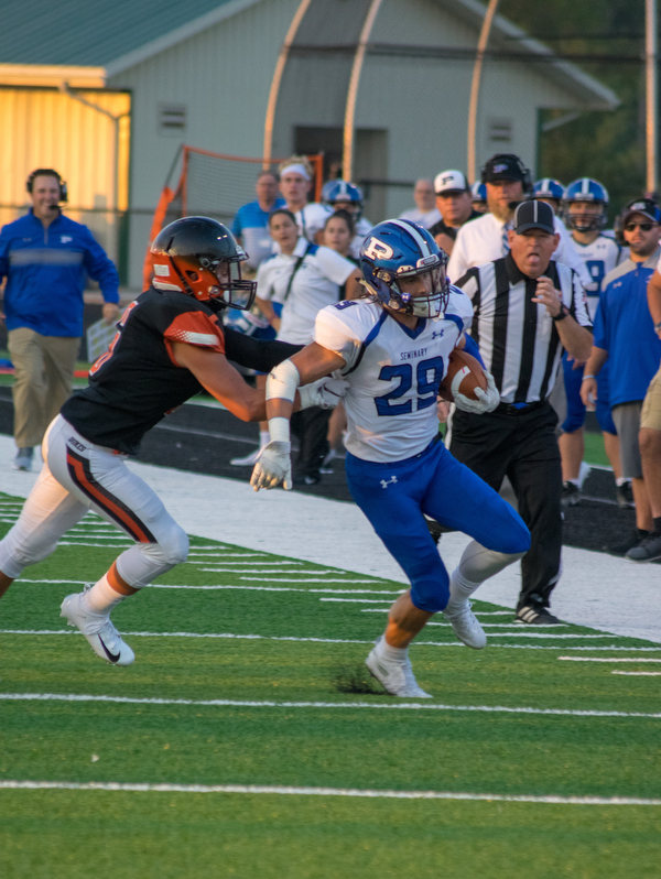 Poland receiver Mitchell Frederick is pushed out of bounds by Marlington defender Ryan Cooley in the Bulldogs' 17-14 victory Thursday night in Alliance...BOB ETTINGER | THE VINDICATOR.￼..