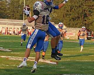 Jimmy Mayberry (16) and Cody Wise (84) of Western Reserve celebrate a touchdown reception by Mayberry in the first quarter of Thursday night's matchup at Firestone Park in Columbiana. Dustin Livesay  |  The Vindicator  8/23/18  Columbiana