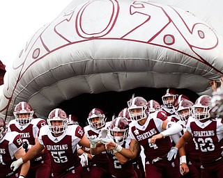 Boardman runs onto the field before their game against East at Boardman on Friday night. EMILY MATTHEWS | THE VINDICATOR