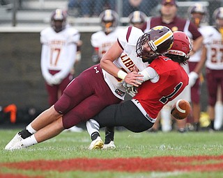 Zach Coman (3) of Liberty hits Keyshawn Chism (1) of Stuthers causing a fumble on a punt return during Friday nights matchup at Struthers High School. Dustin Livesay  |  The Vindicator  8/24/18  Struthers