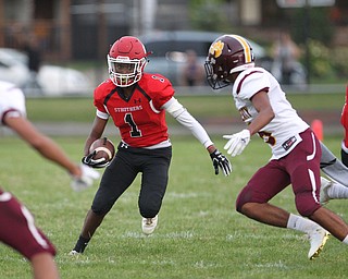 Keyshawn Chism (1) of Struthers puts a juke on Migel Burgess (6) of Liberty during Friday nights matchup against Liberty at Struthers High School. Dustin Livesay  |  The Vindicator  8/24/18  Struthers