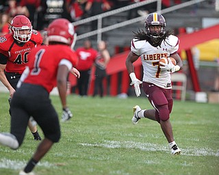 Jalen McKinney (7) of Liberty stares down Keyshawn Chism (1) of Struthers as he runs upfield during Friday nights matchup at Struthers High School. Dustin Livesay  |  The Vindicator  8/24/18  Struthers