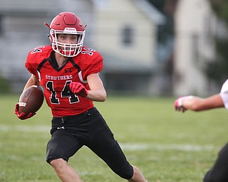 Aiden Hall (14) of Struthers waits for his blockers before cutting upfield during Friday nights matchup against Liberty at Struthers High School. Dustin Livesay  |  The Vindicator  8/24/18  Struthers