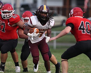 Jalen McKinney (7) of Liberty cuts through the center of the Wildcat defense during Friday nights matchup at Struthers High School. Dustin Livesay  |  The Vindicator  8/24/18  Struthers