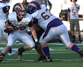 WAREEN, OHIO -August 25, 2018: CHAMPION FLASHES vs JOHN. F. KENNEDY EAGLES at Mollenkopf Stadium, Warren, OH-  Champion Flashes' Austin Willforth (36) runs for a 1st down during the 1st qtr.  MICHAEL G. TAYLOR | THE VINDICATOR