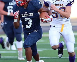 WAREEN, OHIO -August 25, 2018: CHAMPION FLASHES vs JOHN. F. KENNEDY EAGLES at Mollenkopf Stadium, Warren, OH-  JFK Eagles' Savone Williamson (3) runs for a big gain as Champion Flashes' Jacob Pawcio  (59) pursues during the 1st qtr.  MICHAEL G. TAYLOR | THE VINDICATOR..